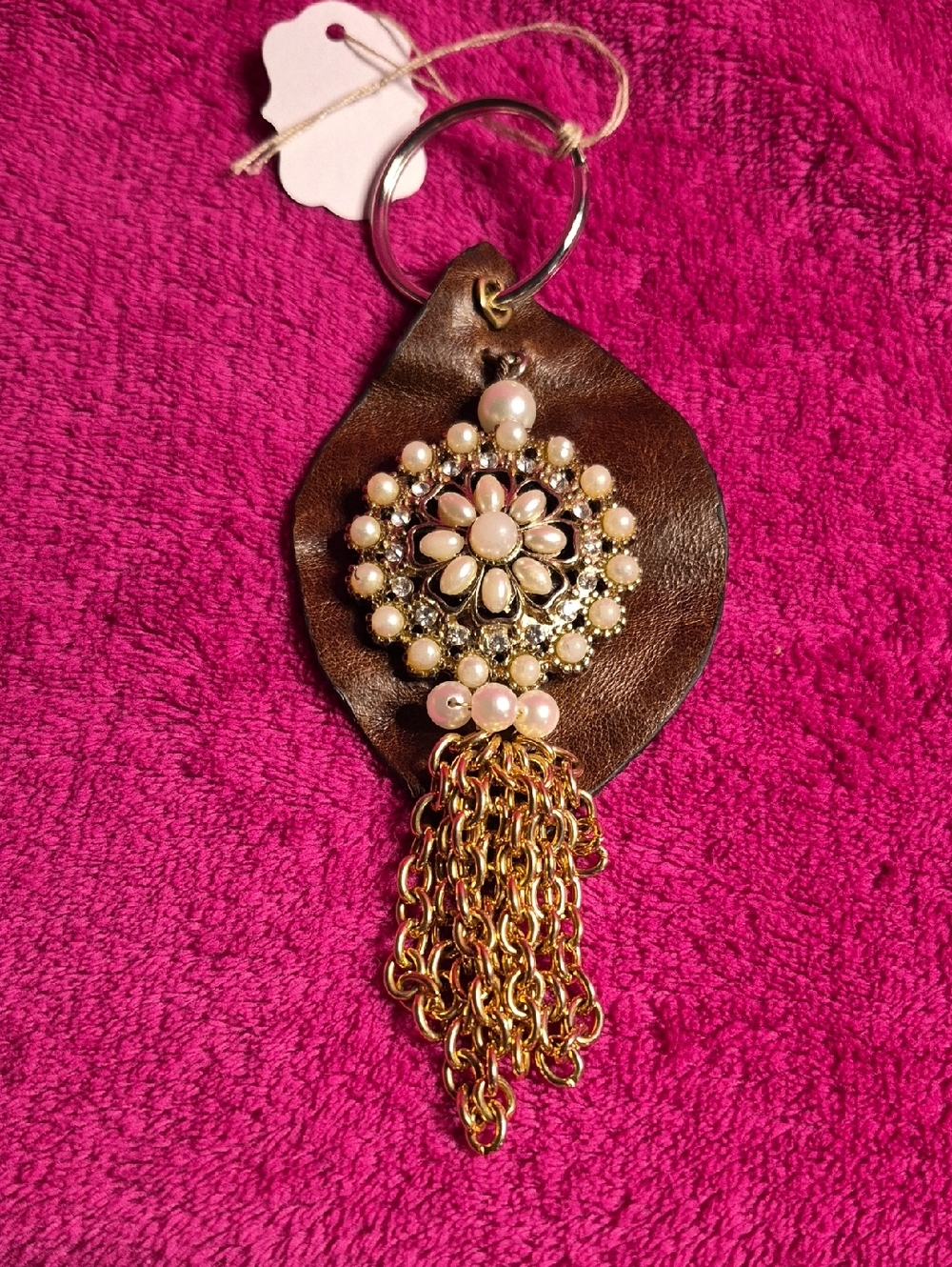 Pearl Floral Tassel Keychain on Brown Leather